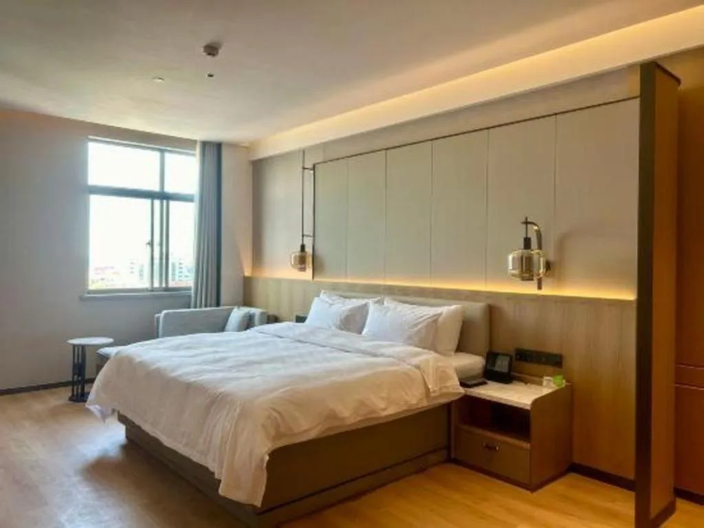 Bed in Zhangjiagang Jiangnan Garden Hotel