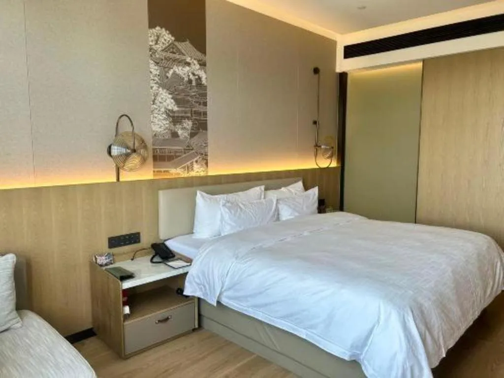 Bed in Zhangjiagang Jiangnan Garden Hotel