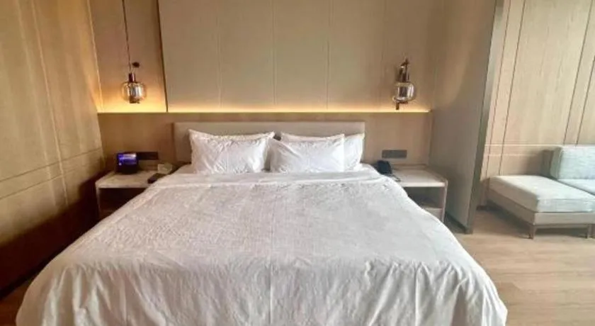 Bed in Zhangjiagang Jiangnan Garden Hotel