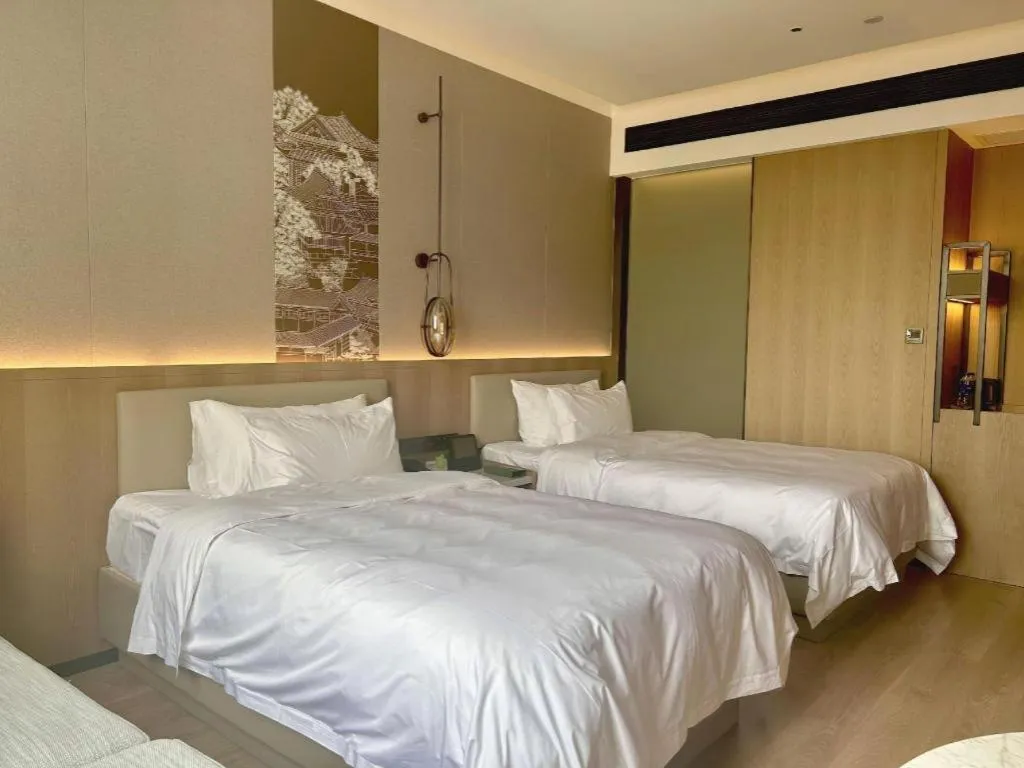 Bed in Zhangjiagang Jiangnan Garden Hotel