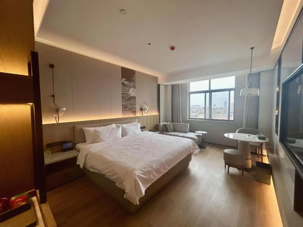 Bed in Zhangjiagang Jiangnan Garden Hotel