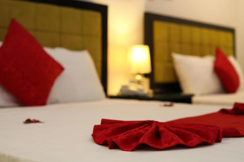 Bed in Helios Legend Hotel