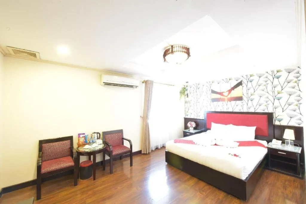 Bed in Helios Legend Hotel