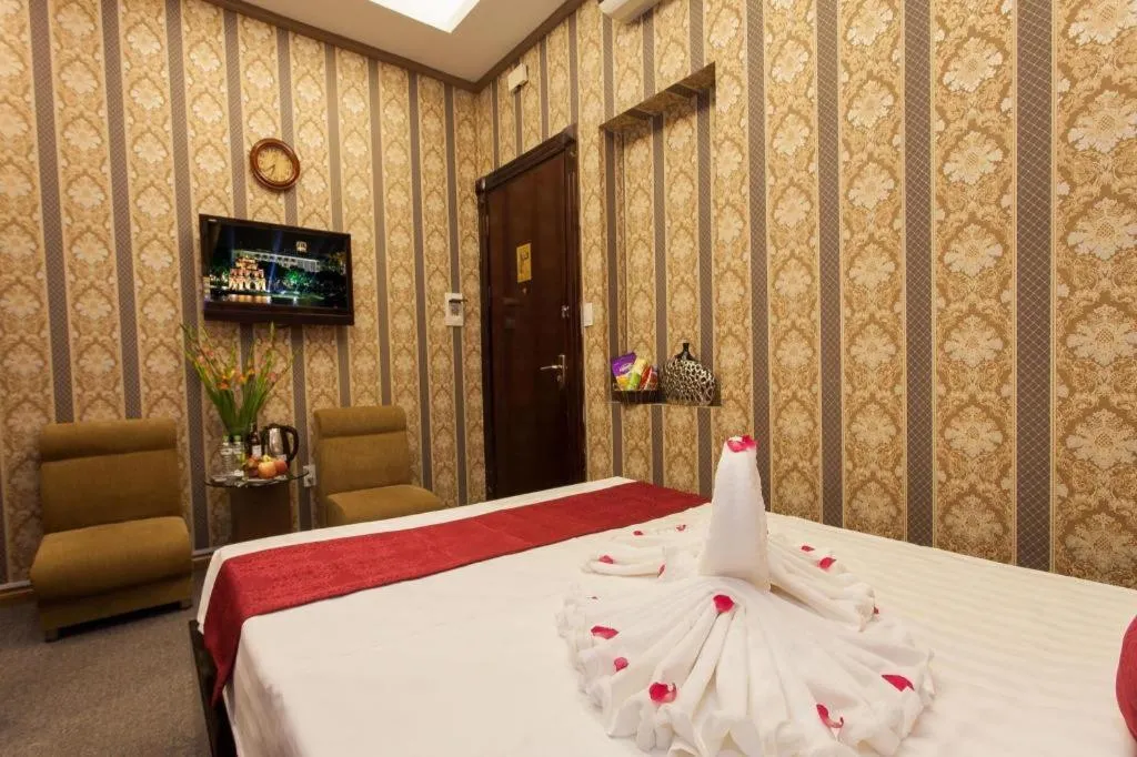 Bed in Helios Legend Hotel