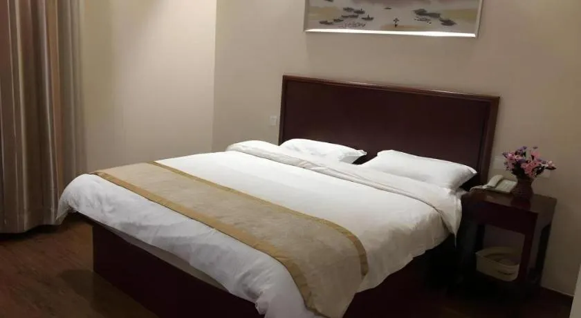 Bed in GreenTree Inn Jiangsu Wuxi New District High Speed Rail Station Newland Family Express Hotel