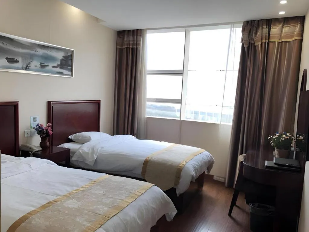 Bed in GreenTree Inn Jiangsu Wuxi New District High Speed Rail Station Newland Family Express Hotel