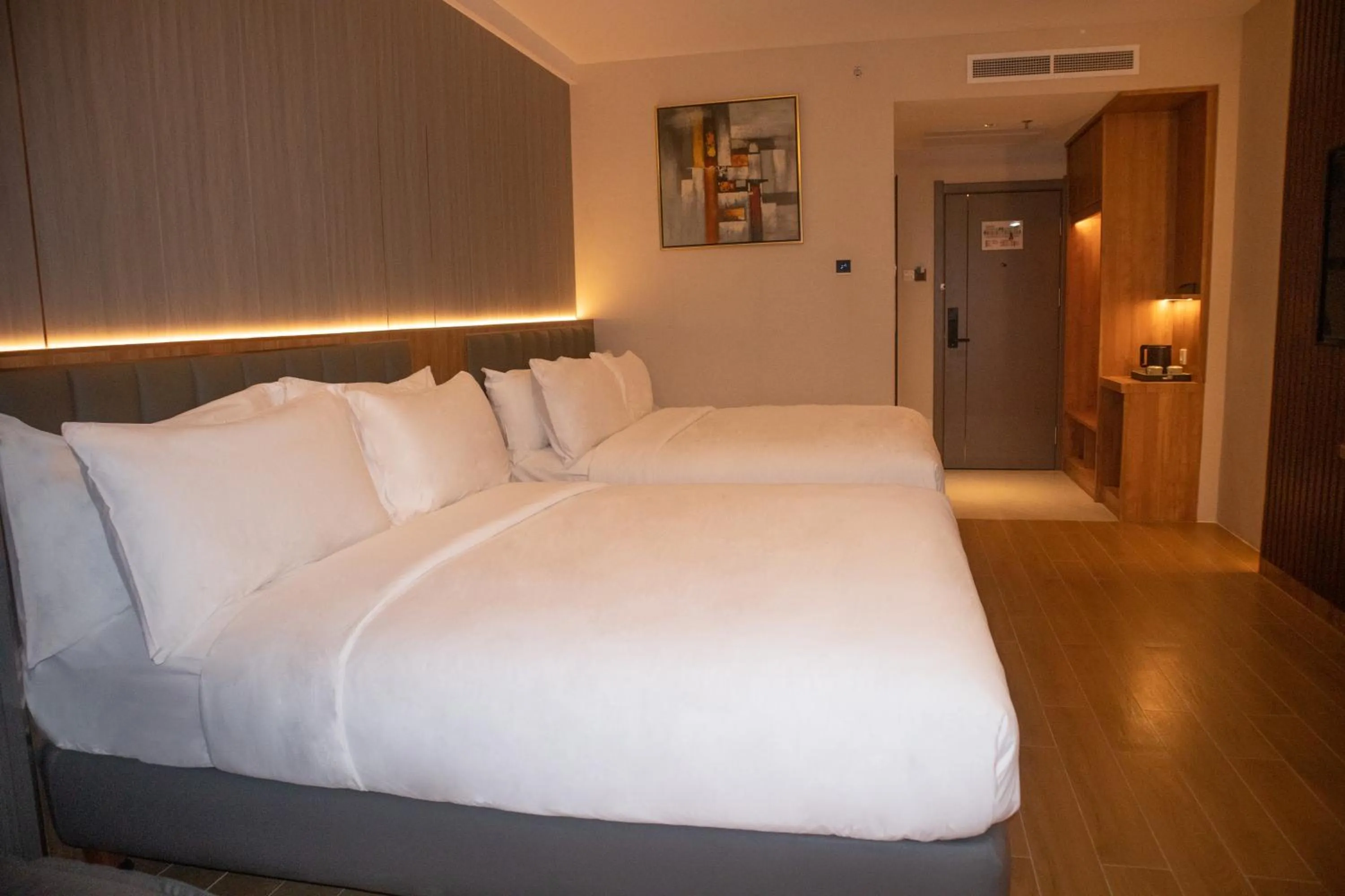 Bed in Aglow Hotel Harbor Bay Batam