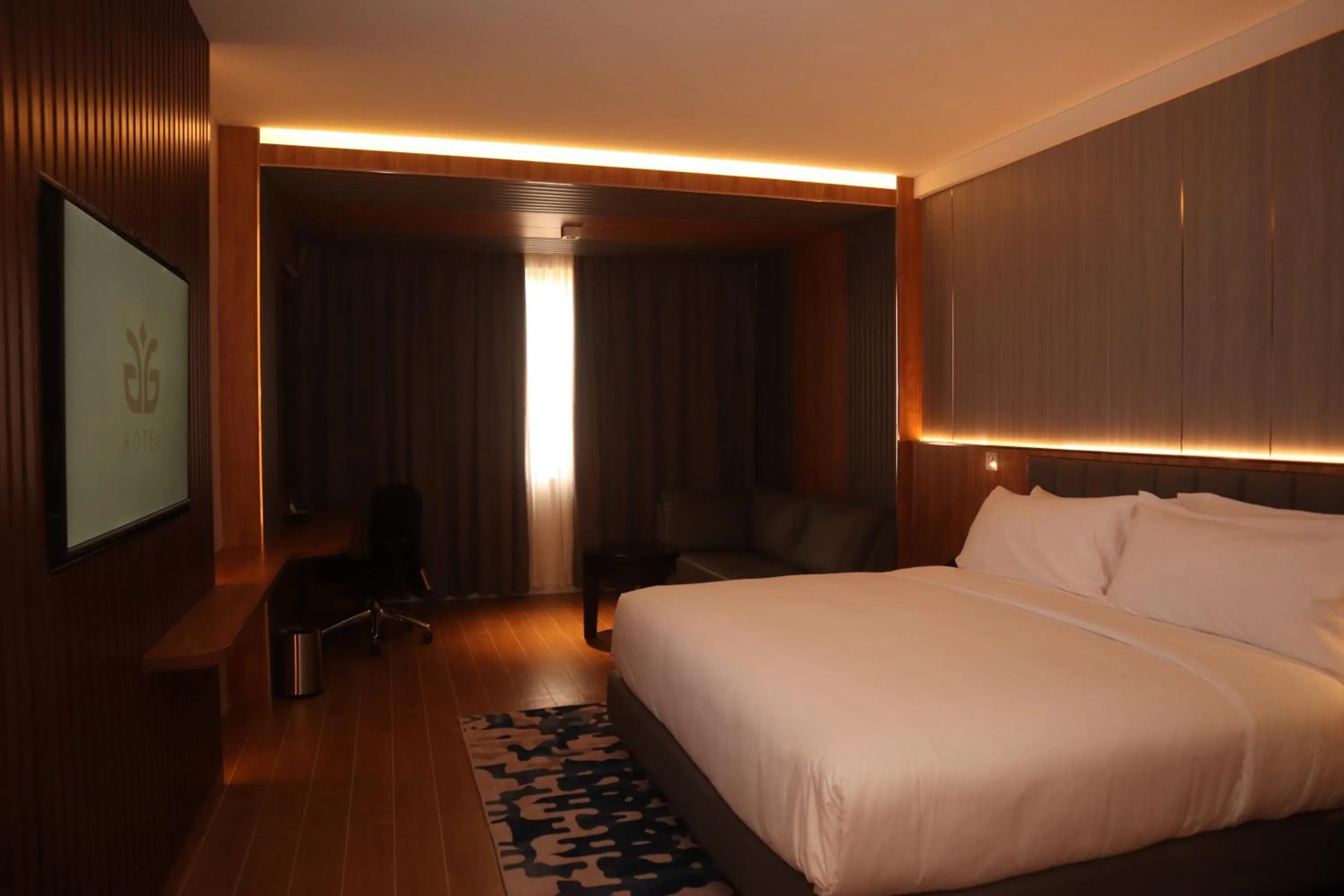 Bed in Aglow Hotel Harbor Bay Batam