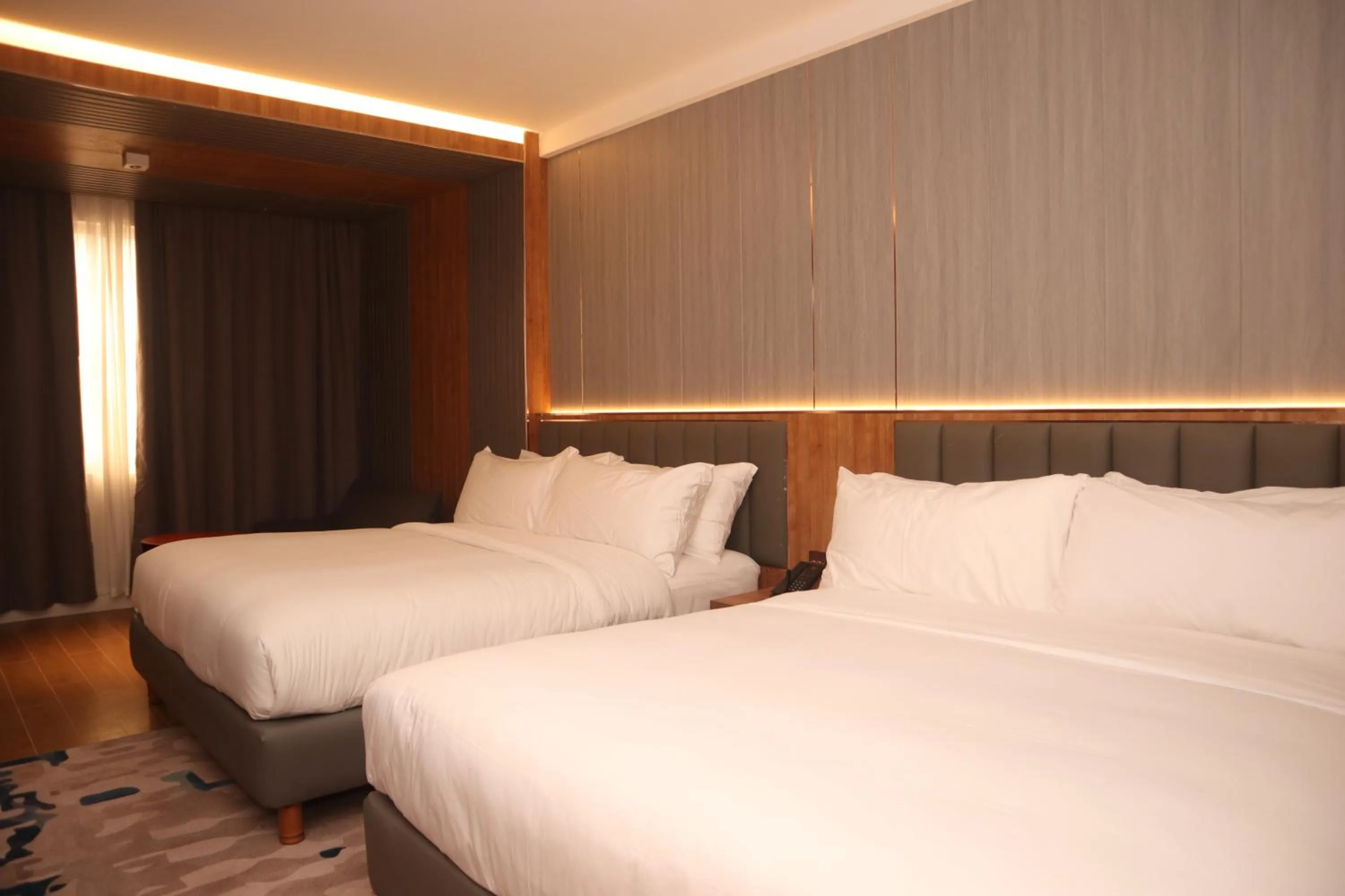 Bed in Aglow Hotel Harbor Bay Batam