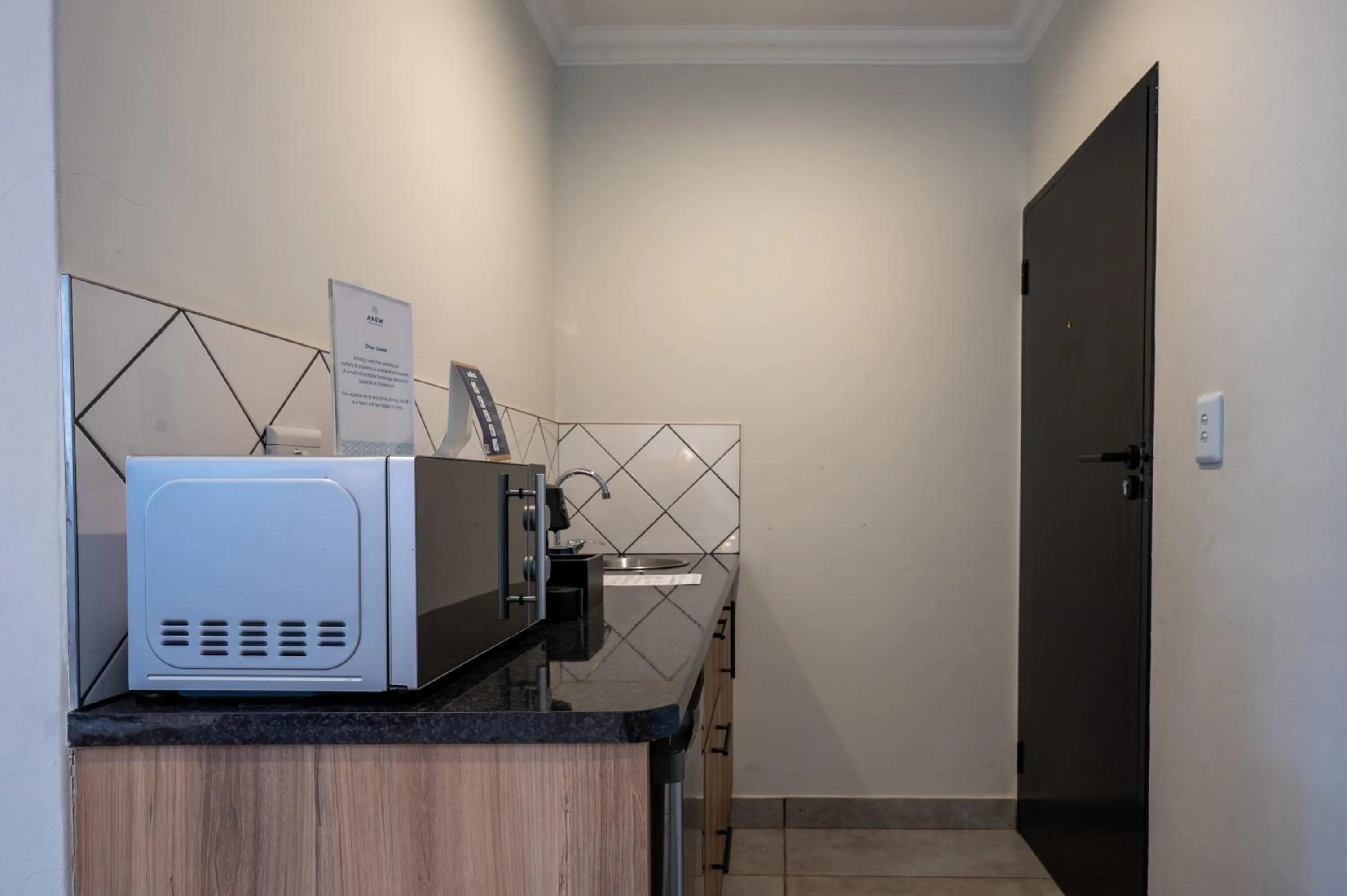 Kitchen or kitchenette in ANEW Hotel & Convention Centre OR Tambo Johannesburg