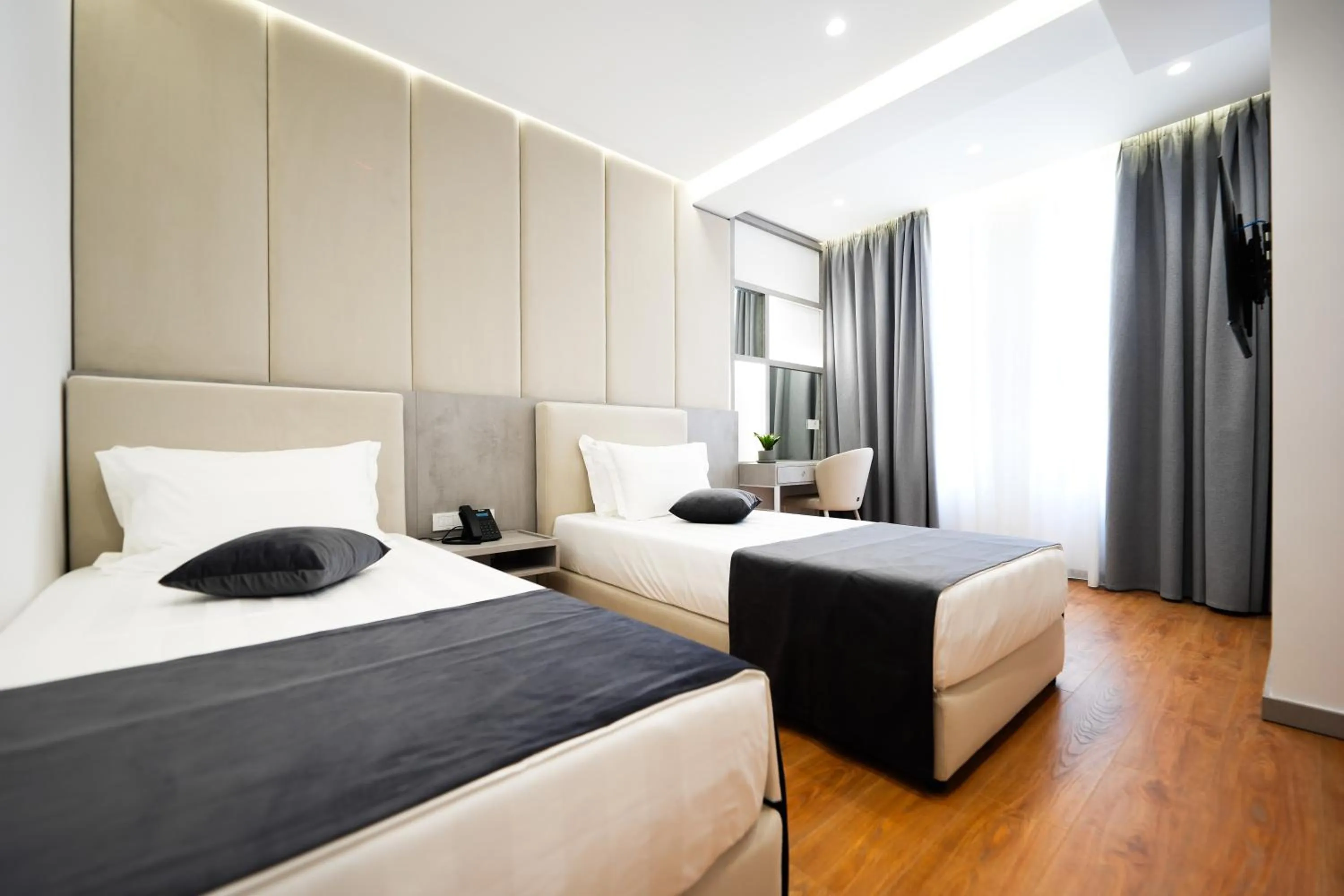 Bed in Naos Luxury Hotel