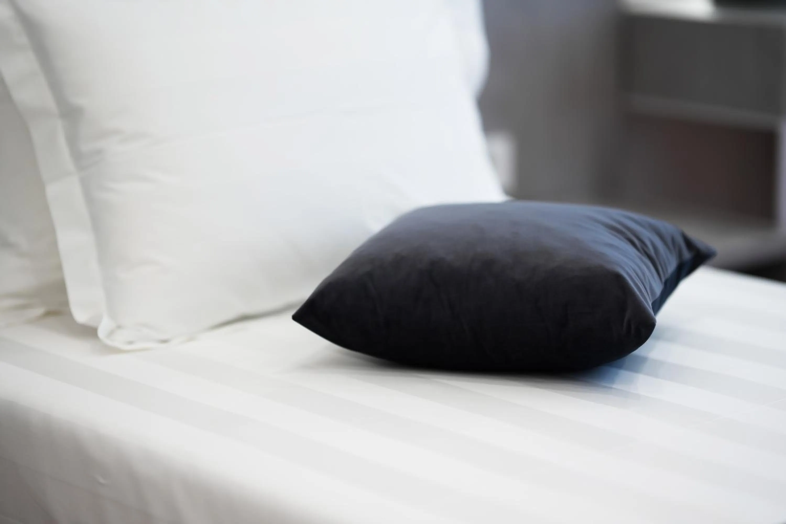 Bed in Naos Luxury Hotel