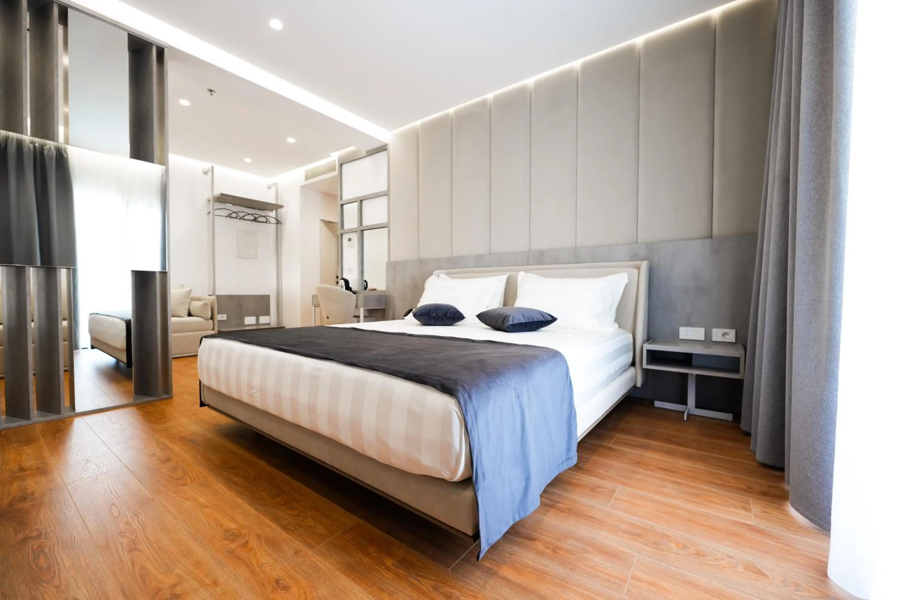 Bed in Naos Luxury Hotel