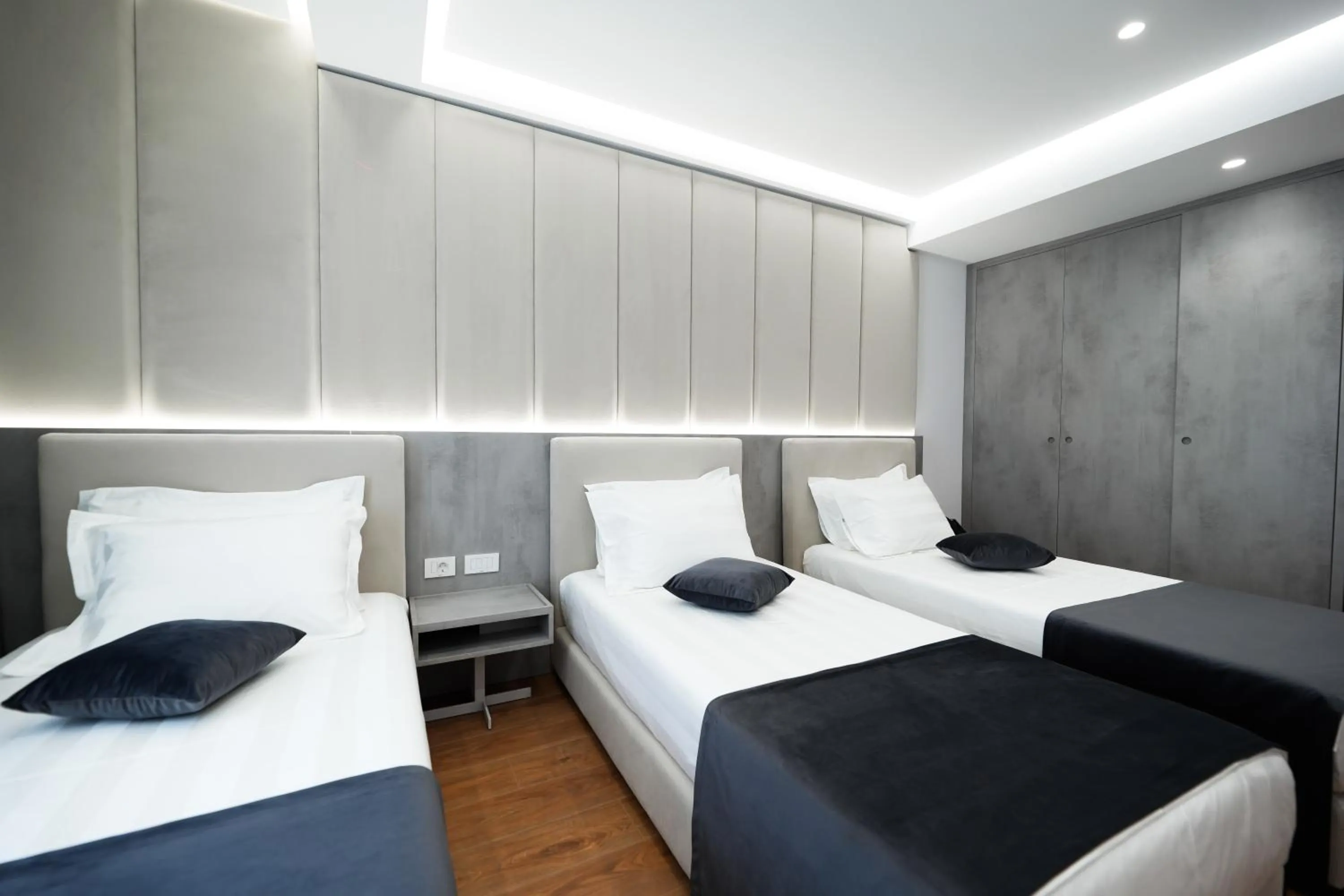 Bed in Naos Luxury Hotel