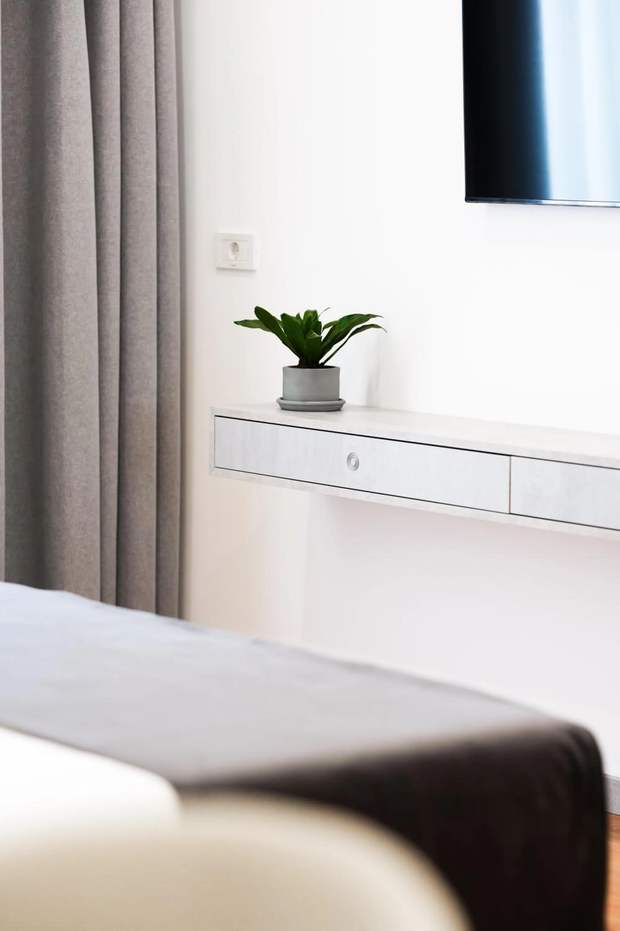 Bed in Naos Luxury Hotel