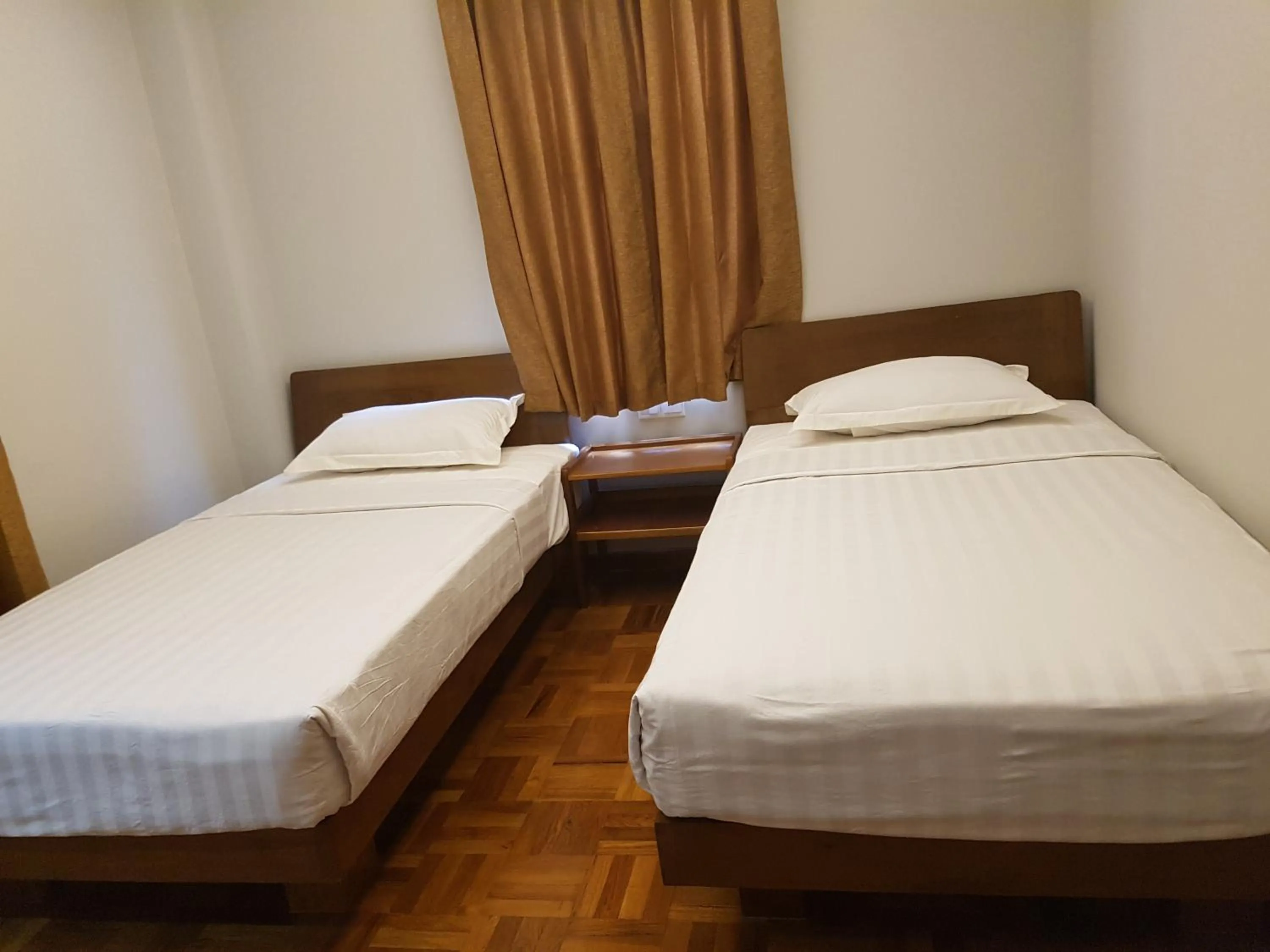 Bed in Northern Breeze Hotel