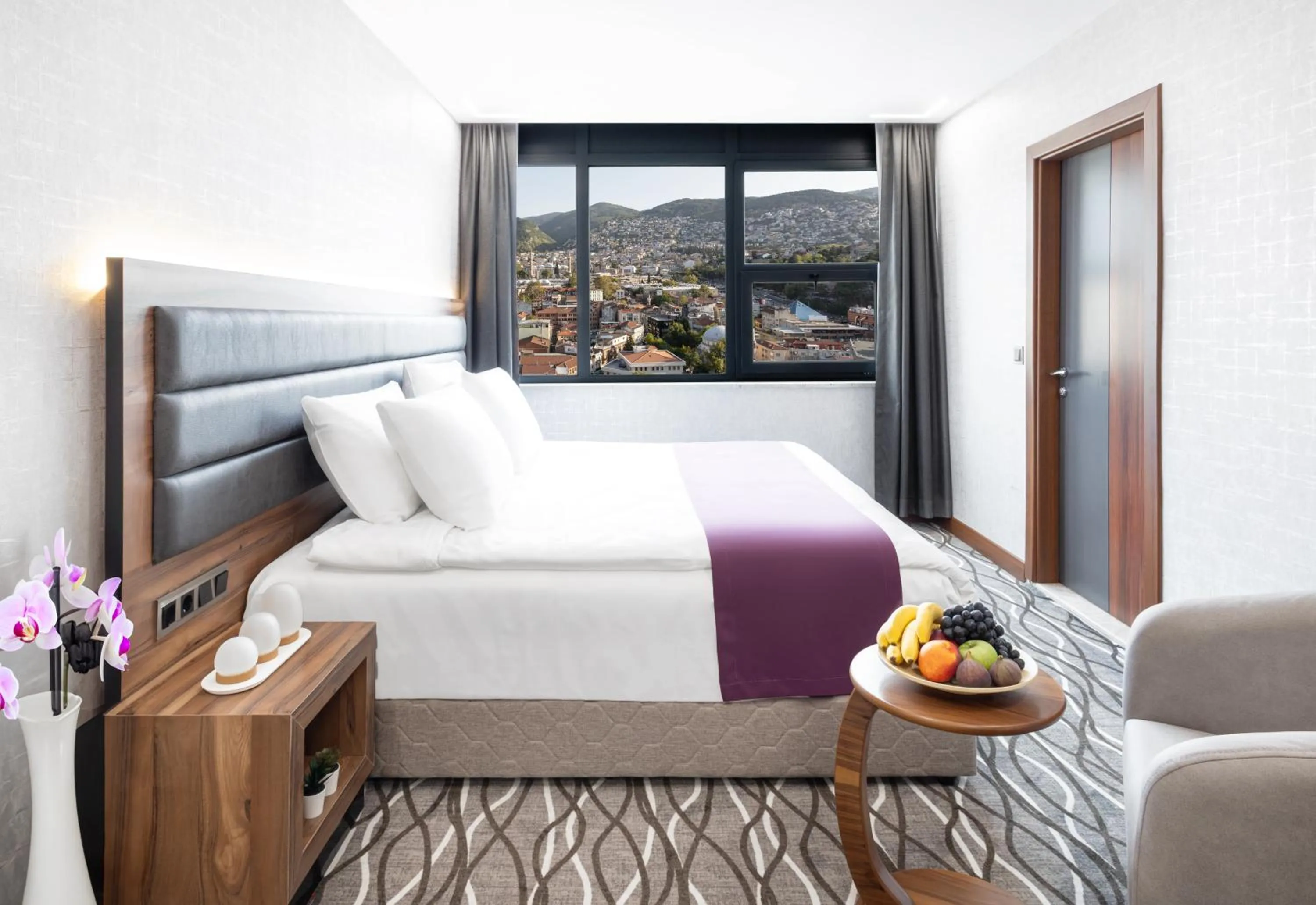 Bed in Lilium Hotel & Suites