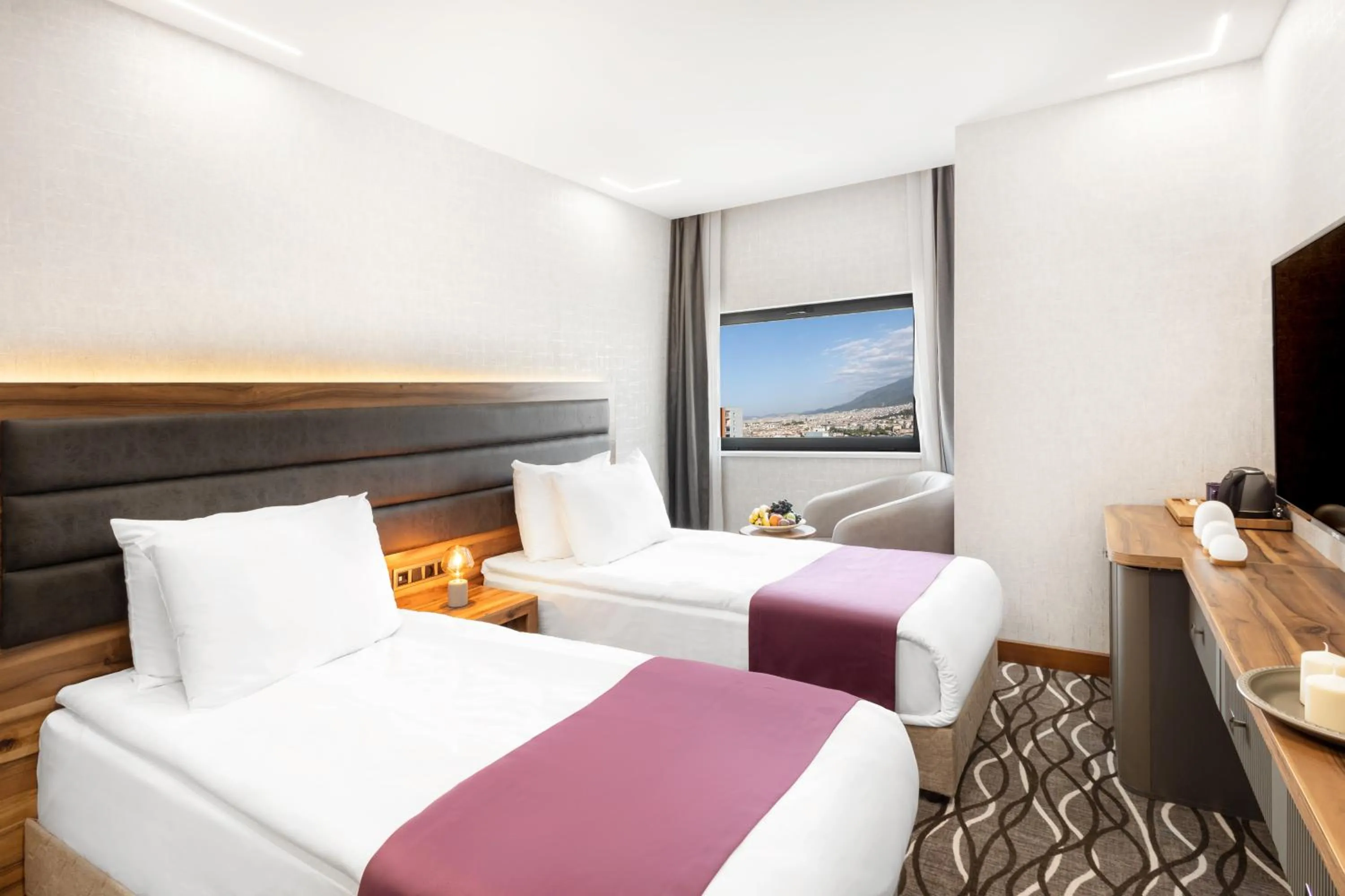 Bed in Lilium Hotel & Suites