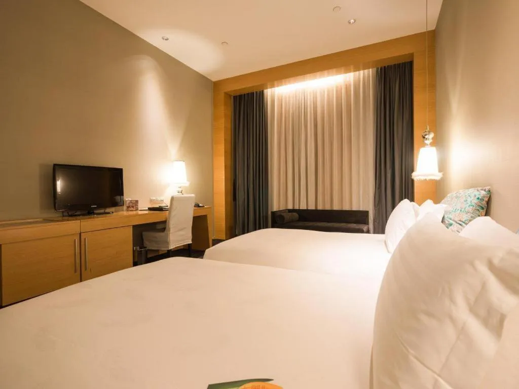 Bed in Guangzhou Carat Hotel