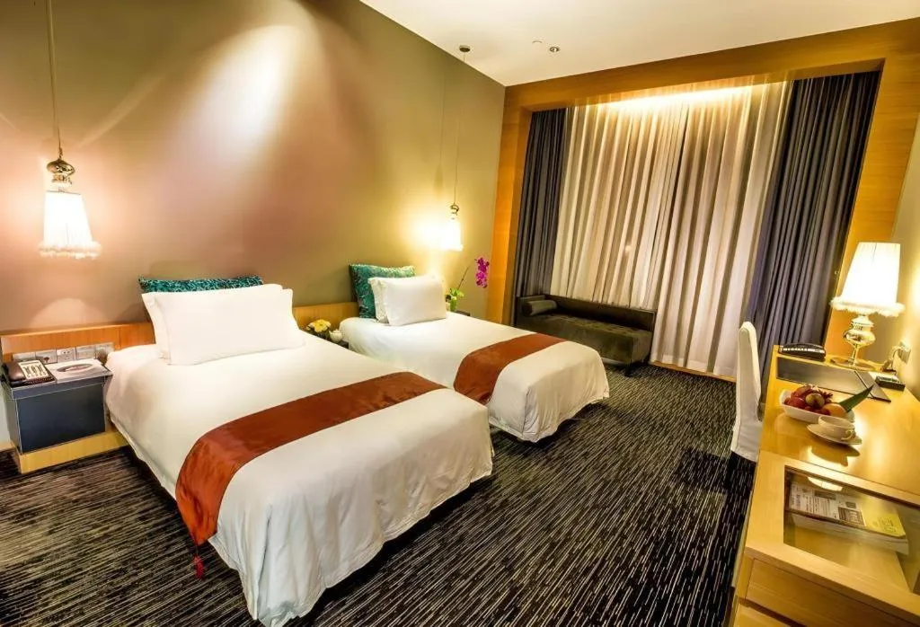 Bed in Guangzhou Carat Hotel