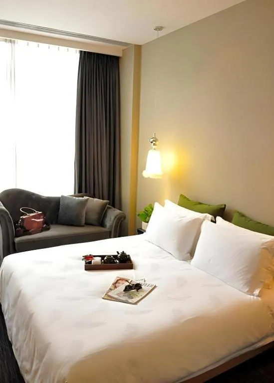 Bed in Guangzhou Carat Hotel