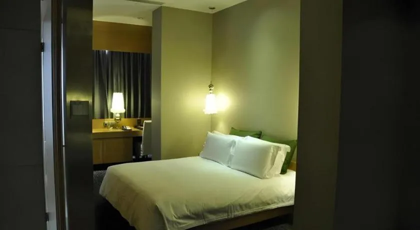 Bed in Guangzhou Carat Hotel