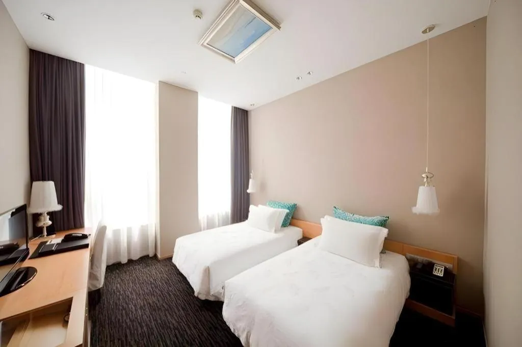 Bed in Guangzhou Carat Hotel