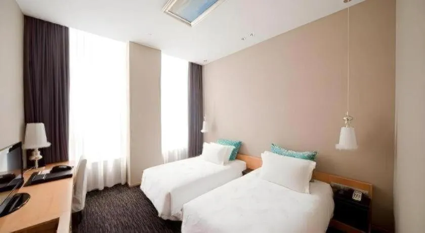Bed in Guangzhou Carat Hotel