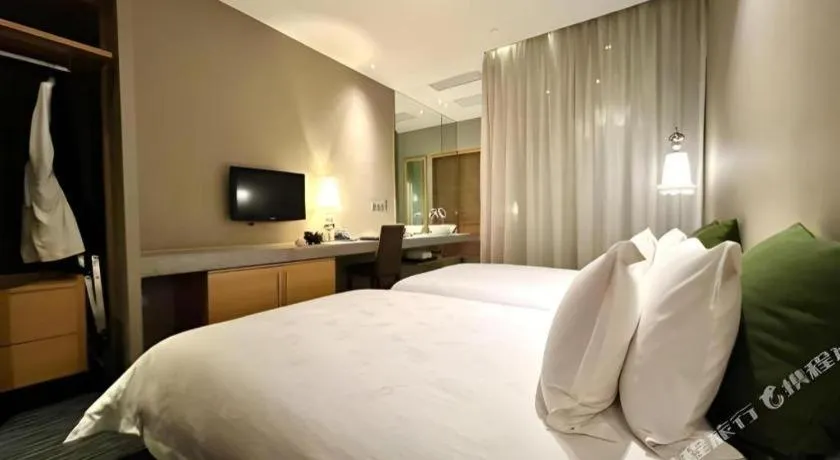 Bed in Guangzhou Carat Hotel