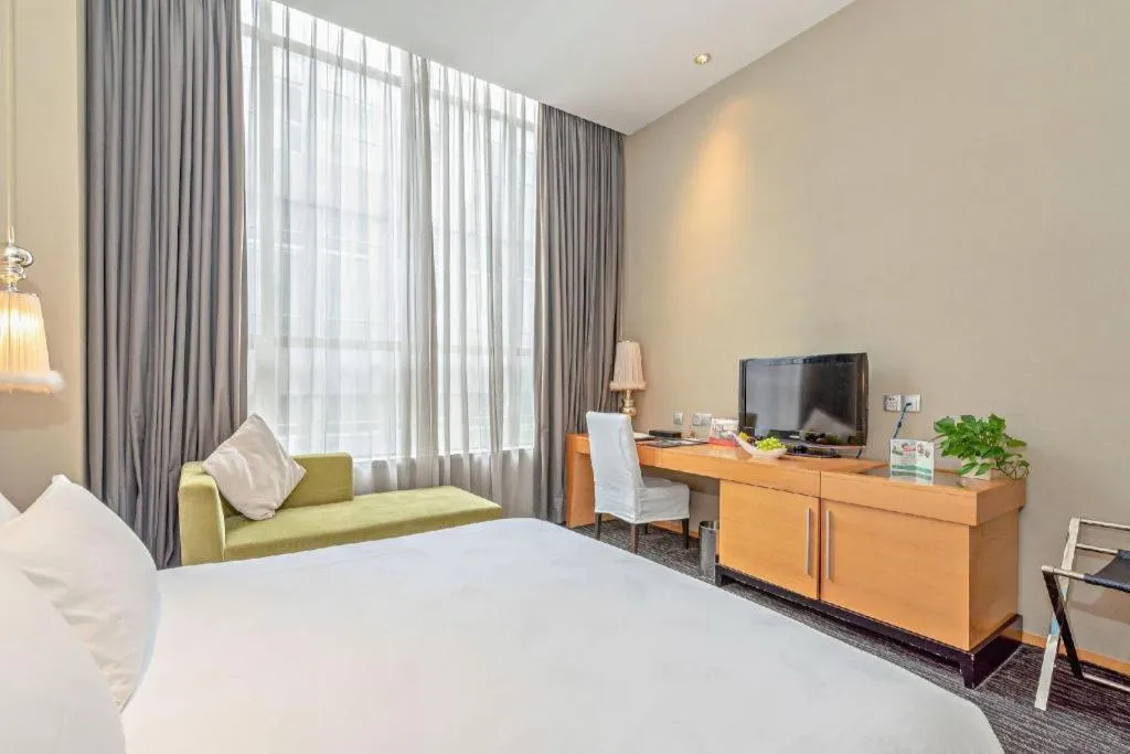 Bed in Guangzhou Carat Hotel