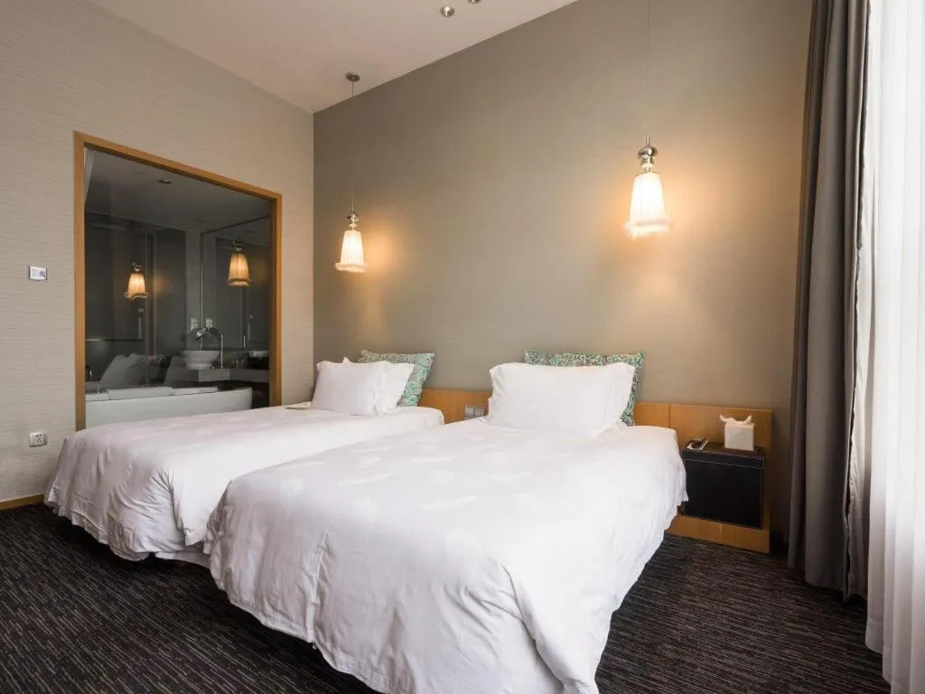 Bed in Guangzhou Carat Hotel