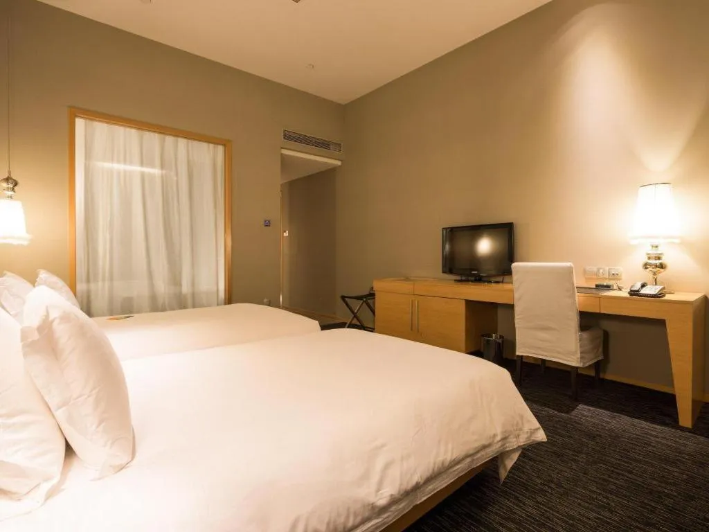 Bed in Guangzhou Carat Hotel