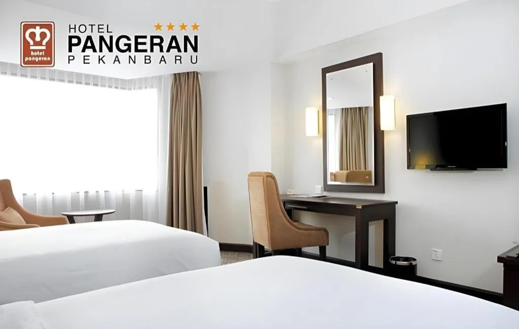 Bed in Hotel Pangeran