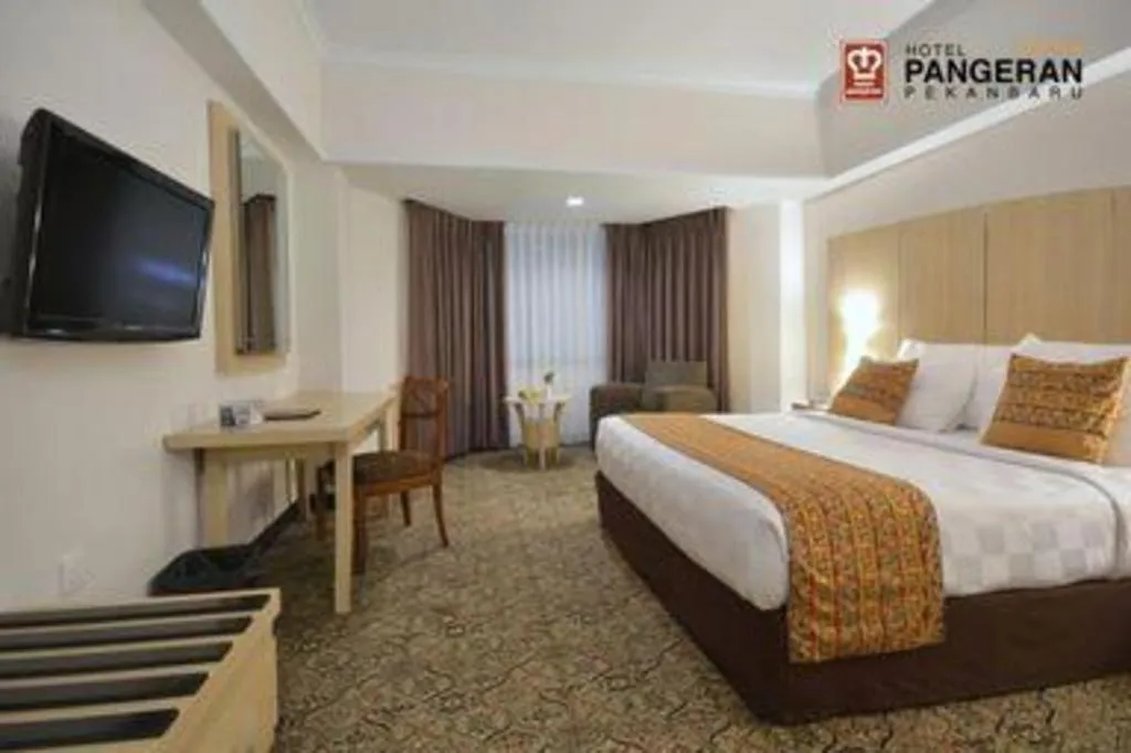 Bed in Hotel Pangeran