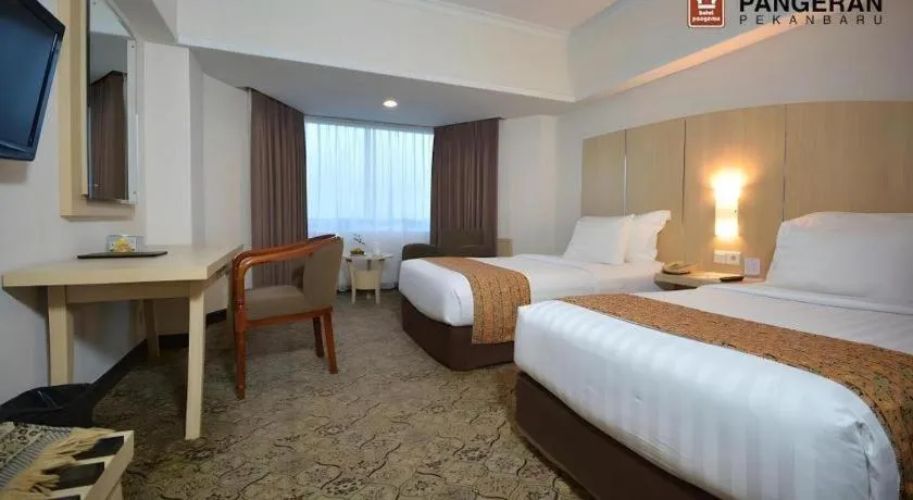 Bed in Hotel Pangeran