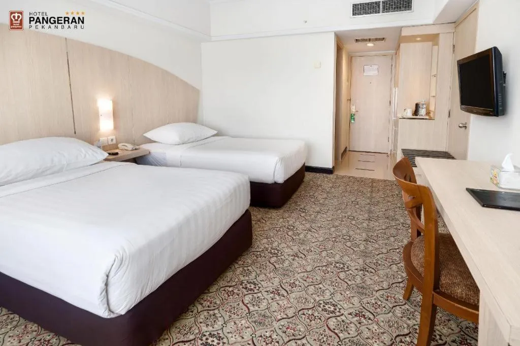 Bed in Hotel Pangeran