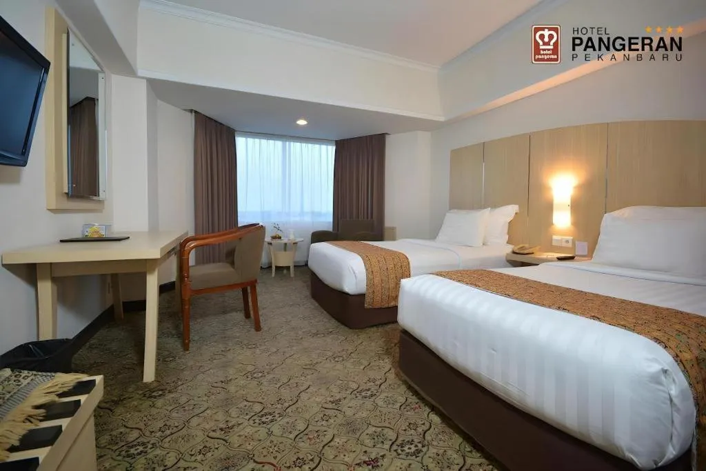 Bed in Hotel Pangeran