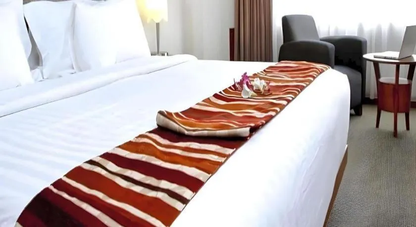 Bed in Hotel Pangeran