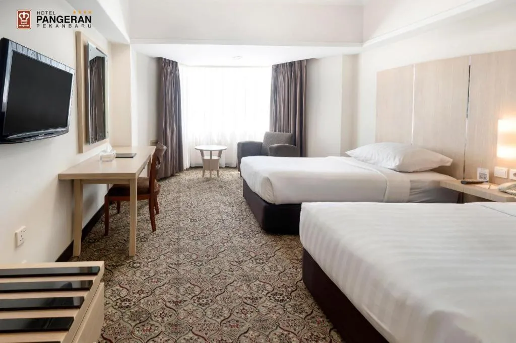 Bed in Hotel Pangeran