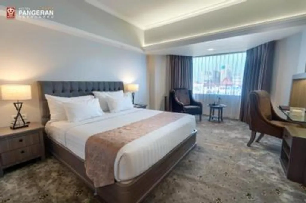 Bed in Hotel Pangeran