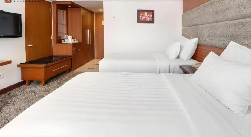 Bed in Hotel Pangeran
