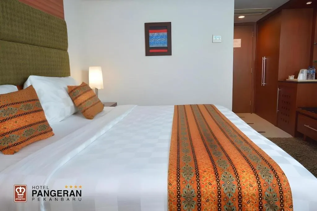 Bed in Hotel Pangeran