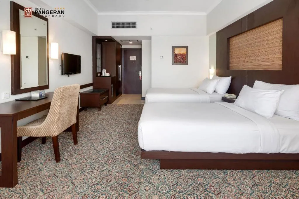 Bed in Hotel Pangeran