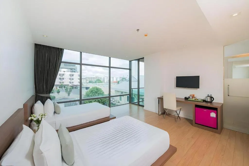 Bed in Seven Zea Chic Hotel