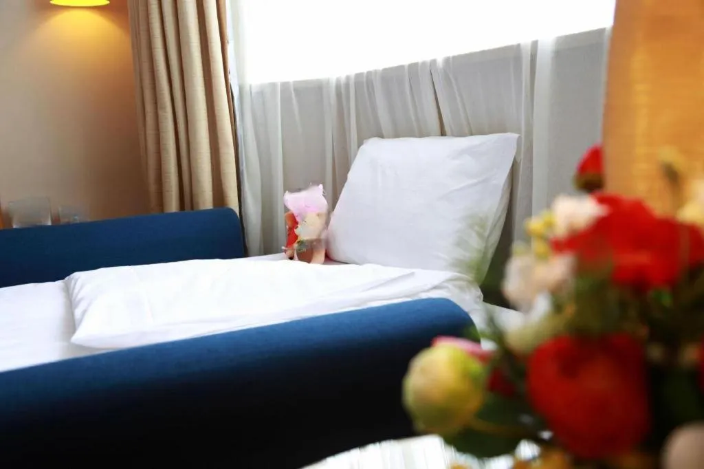 Bed in Jinglun Hotel