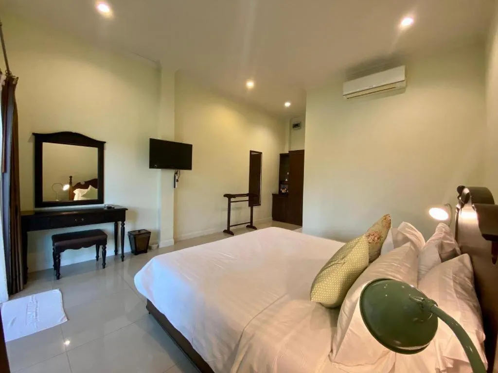 Bed in Ruen Maihom Riverside Cottage