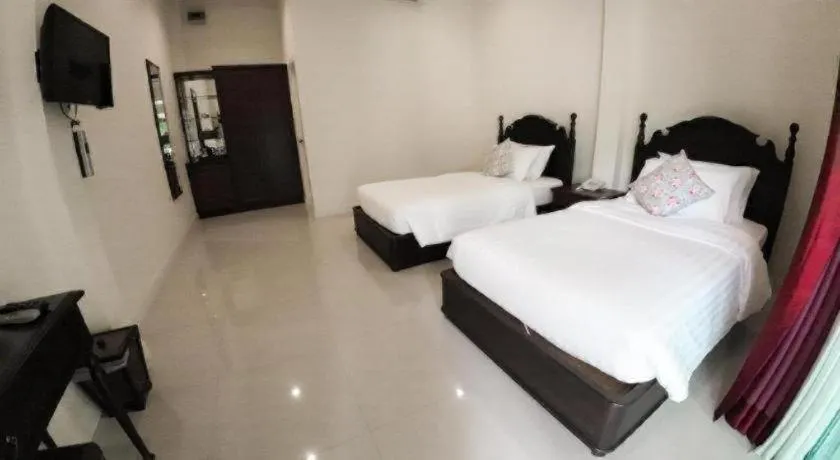 Bed in Ruen Maihom Riverside Cottage