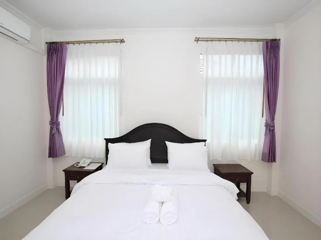 Bed in Ruen Maihom Riverside Cottage