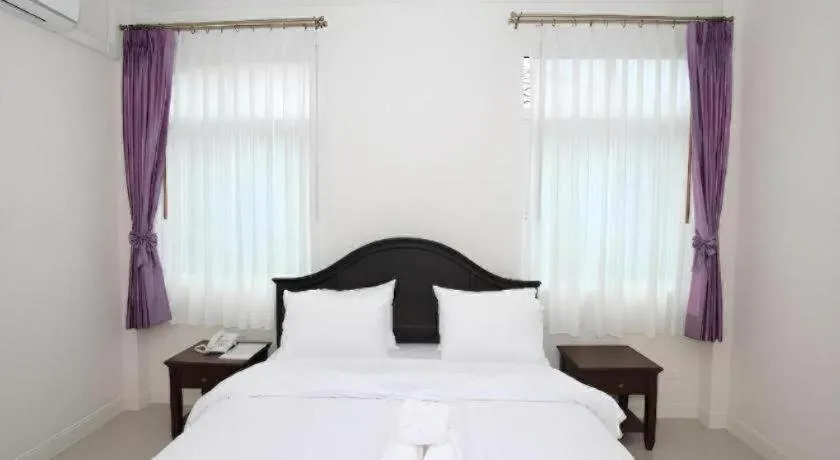 Bed in Ruen Maihom Riverside Cottage