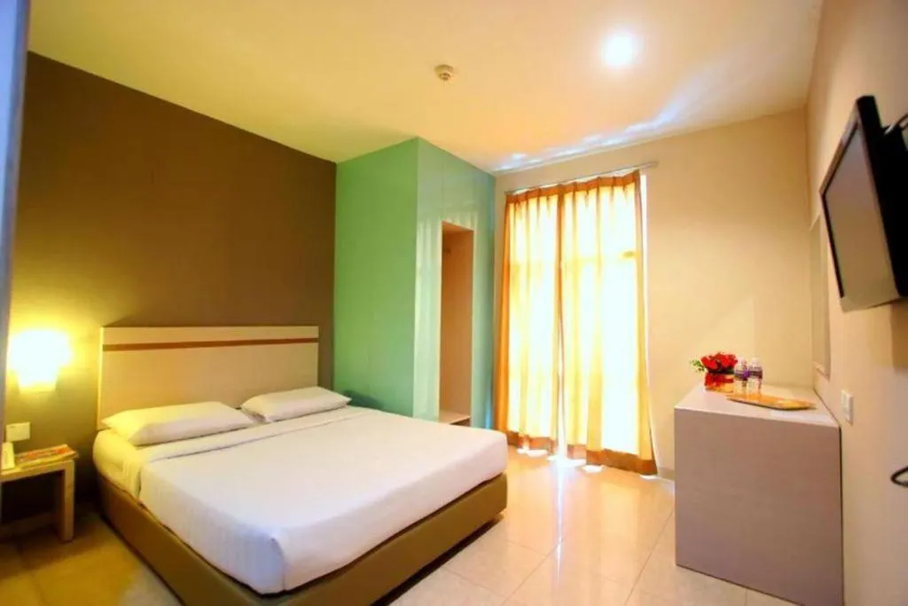 Bed in Lovina Inn Penuin Hotel